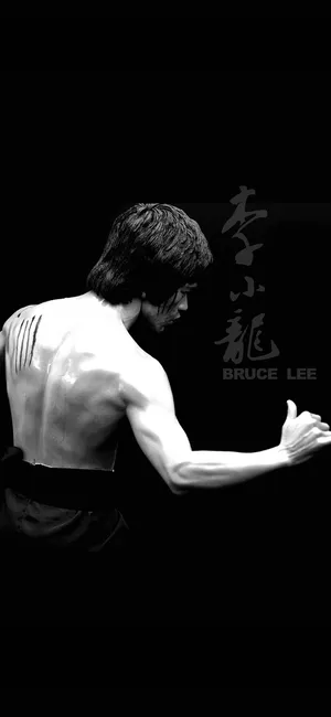 功夫大师李小龙黑色背景图片_1