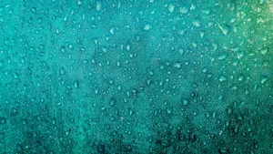 蓝色雨滴玻璃背景图片