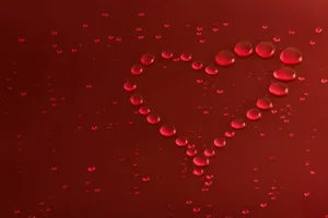 水珠状红色爱心背景图片